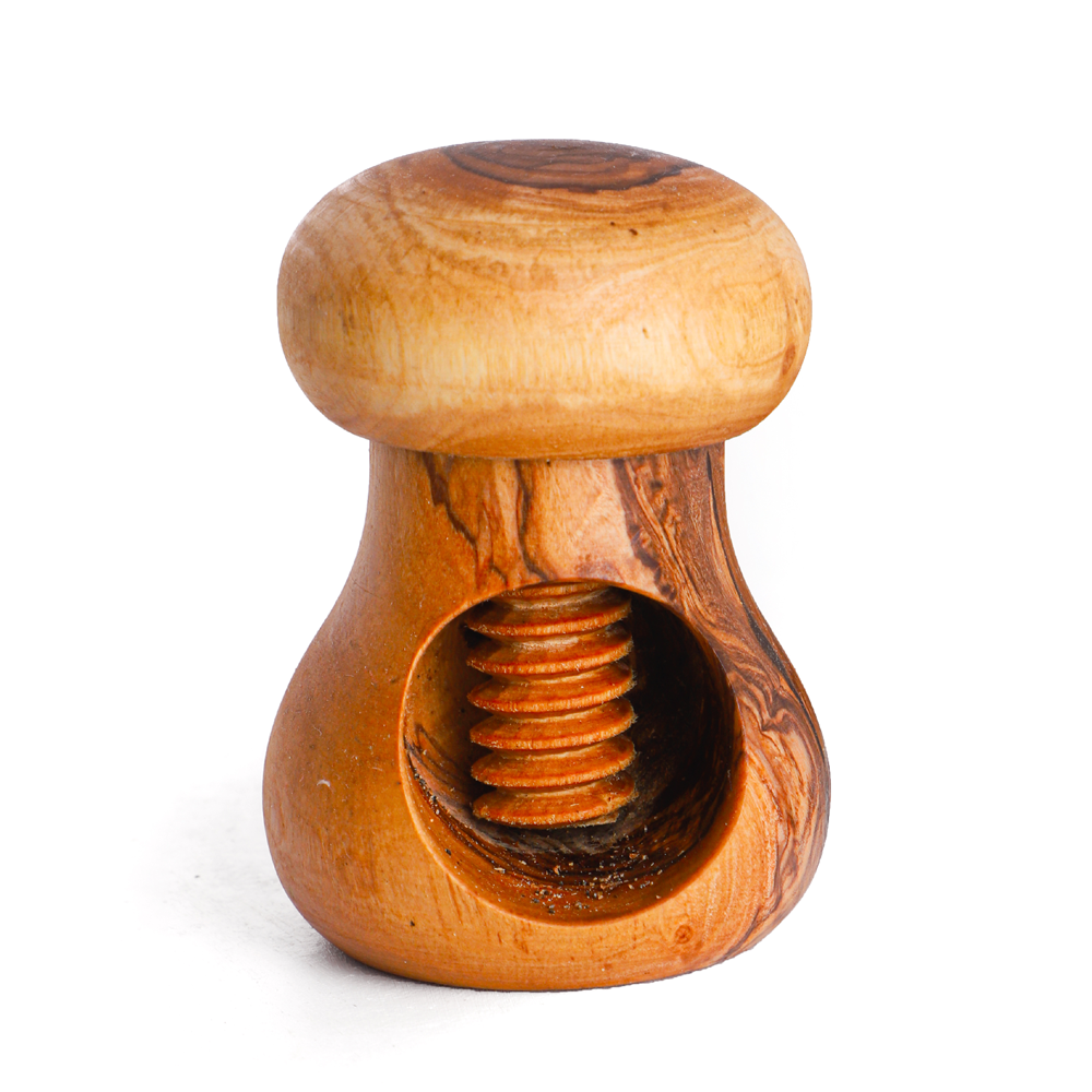 A handmade olive wood nut cracker with a rustic appearance, featuring a natural wood grain.