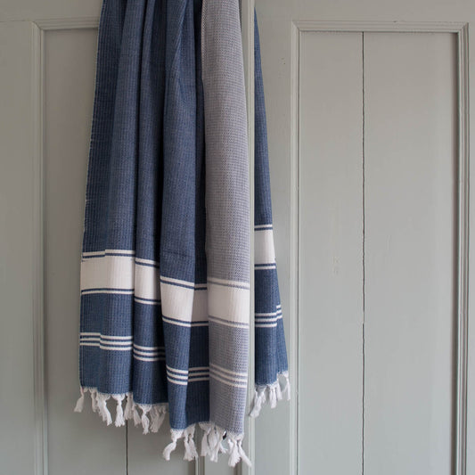 Blue Ocean fouta towel - handmade Turkish cotton beach towel
Fouta hammam towel folded - lightweight quick-dry beach towel
Fouta towel Blue Ocean draped on beach chair